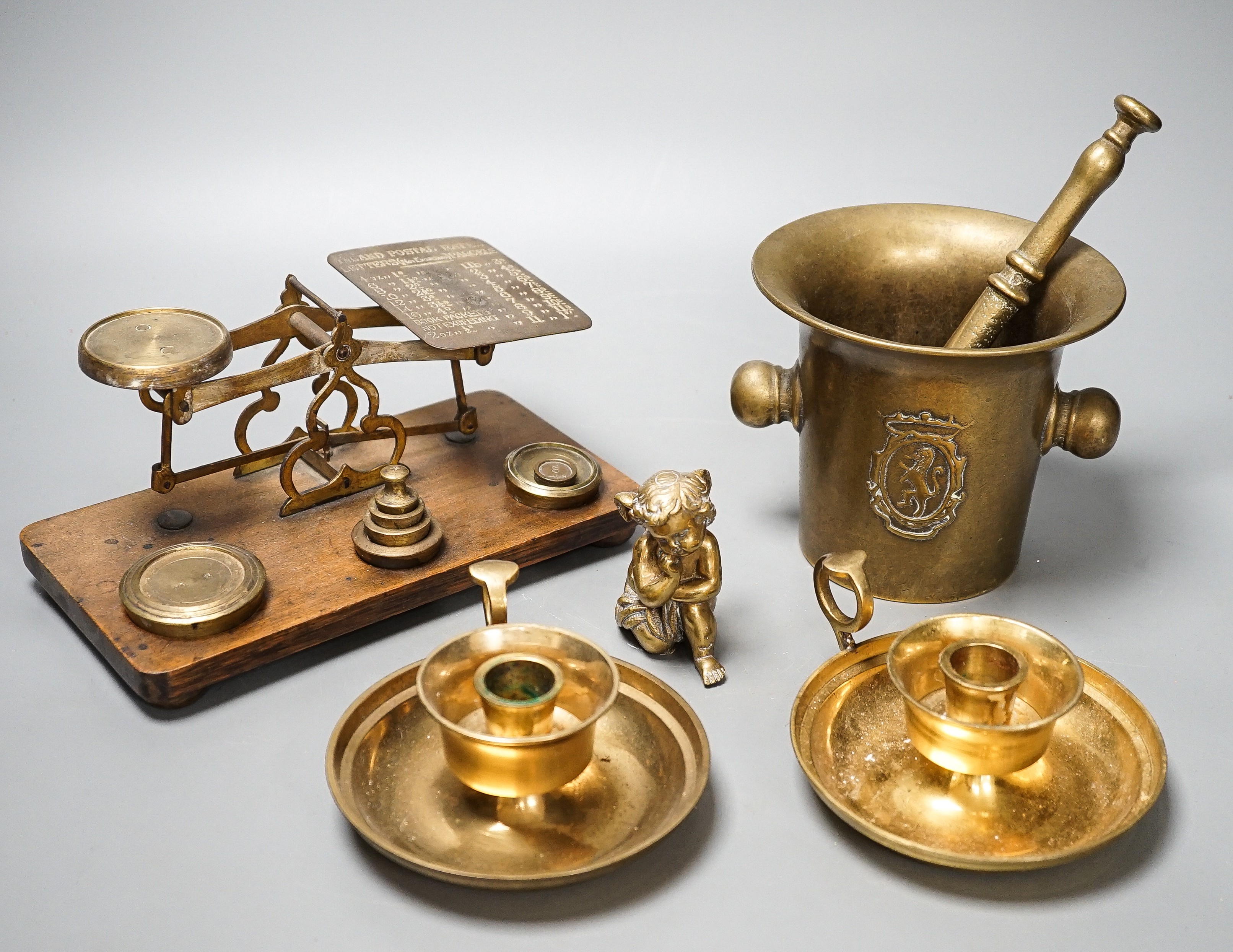 A quantity of bronze and brass wares including a pestle and mortar, candlesticks, coffee grinder etc, tallest items, candlesticks 48 cms high.